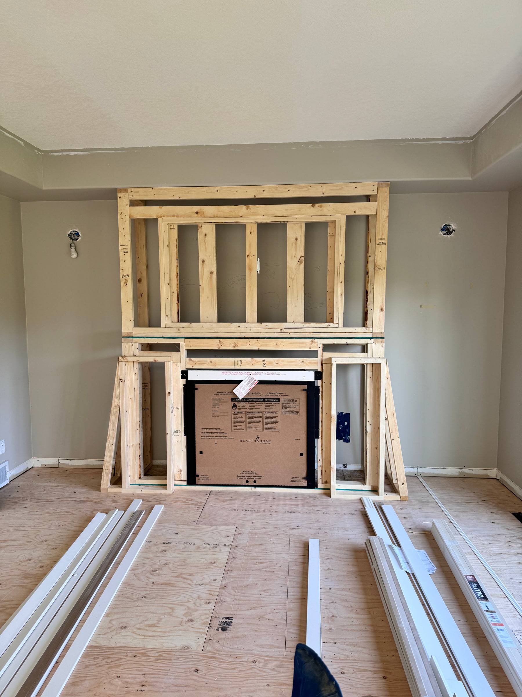 Wood framing for a fireplace bump-out built around a new fireplace insert